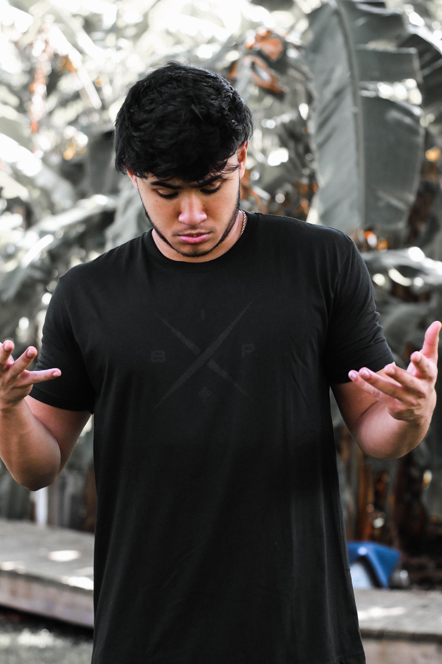 Introducing Nick Ireland wearing the Ireland Boys Productions MAX BLACK merch ft X 2.0 logo in BLACK printed on a BLACK NEXT LEVEL premium T-shirt