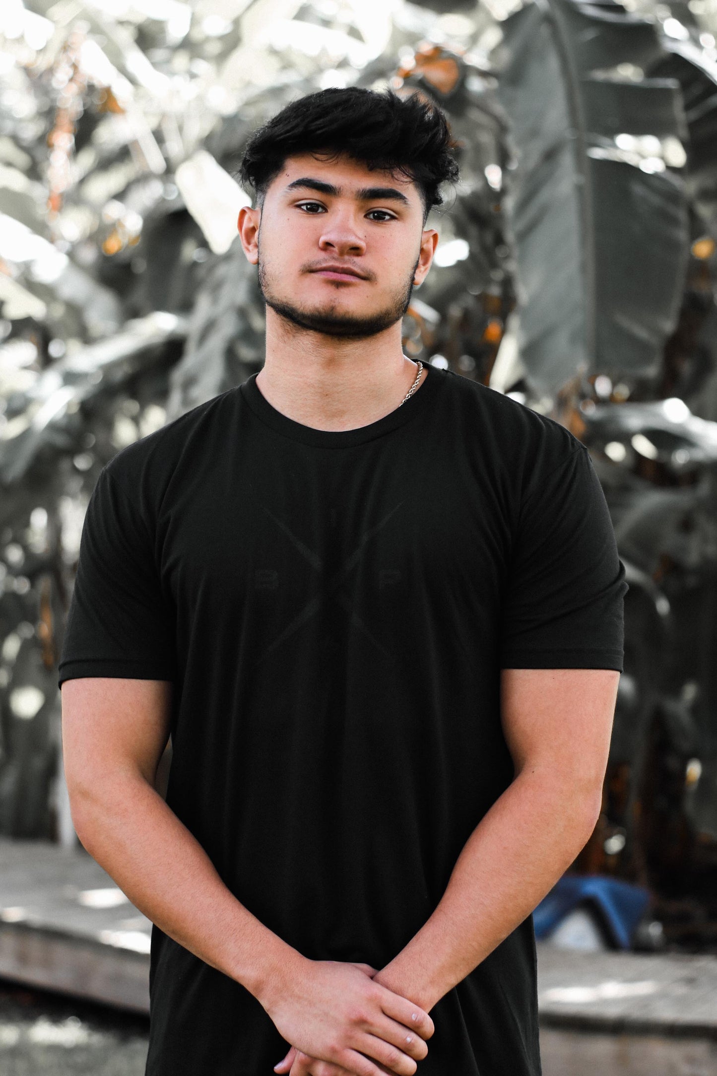 Introducing Nick Ireland wearing the Ireland Boys Productions MAX BLACK merch ft X 2.0 logo in BLACK printed on a BLACK NEXT LEVEL premium T-shirt