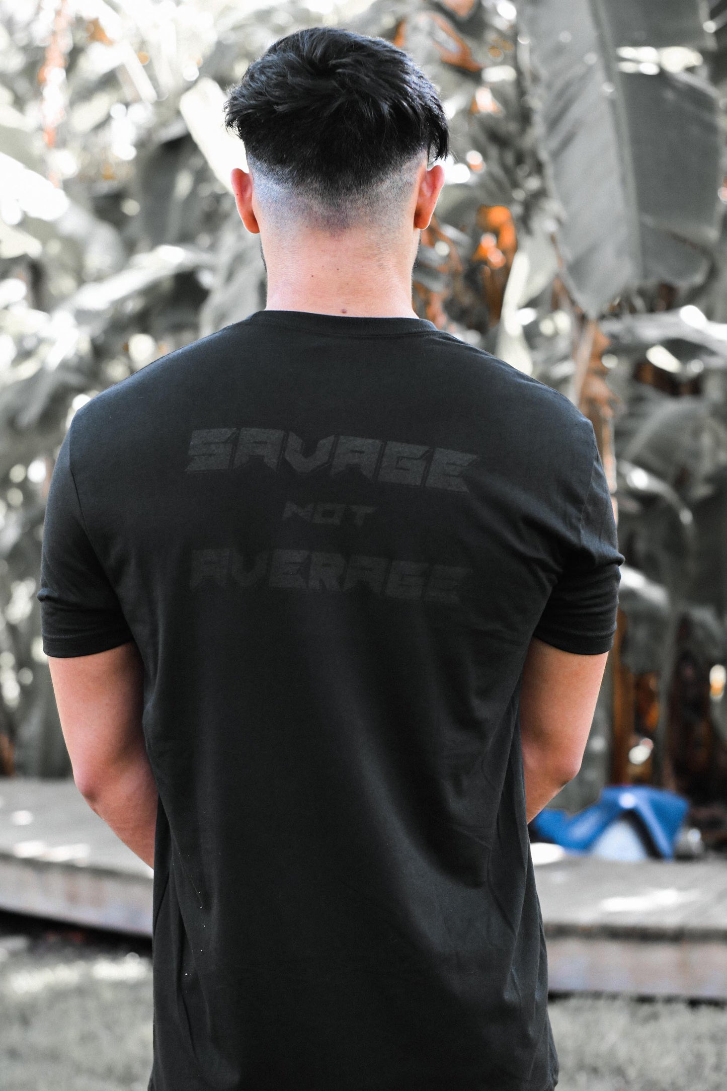 Introducing Nick Ireland wearing the Ireland Boys Productions MAX BLACK merch ft X 2.0 logo in BLACK printed on a BLACK NEXT LEVEL premium T-shirt