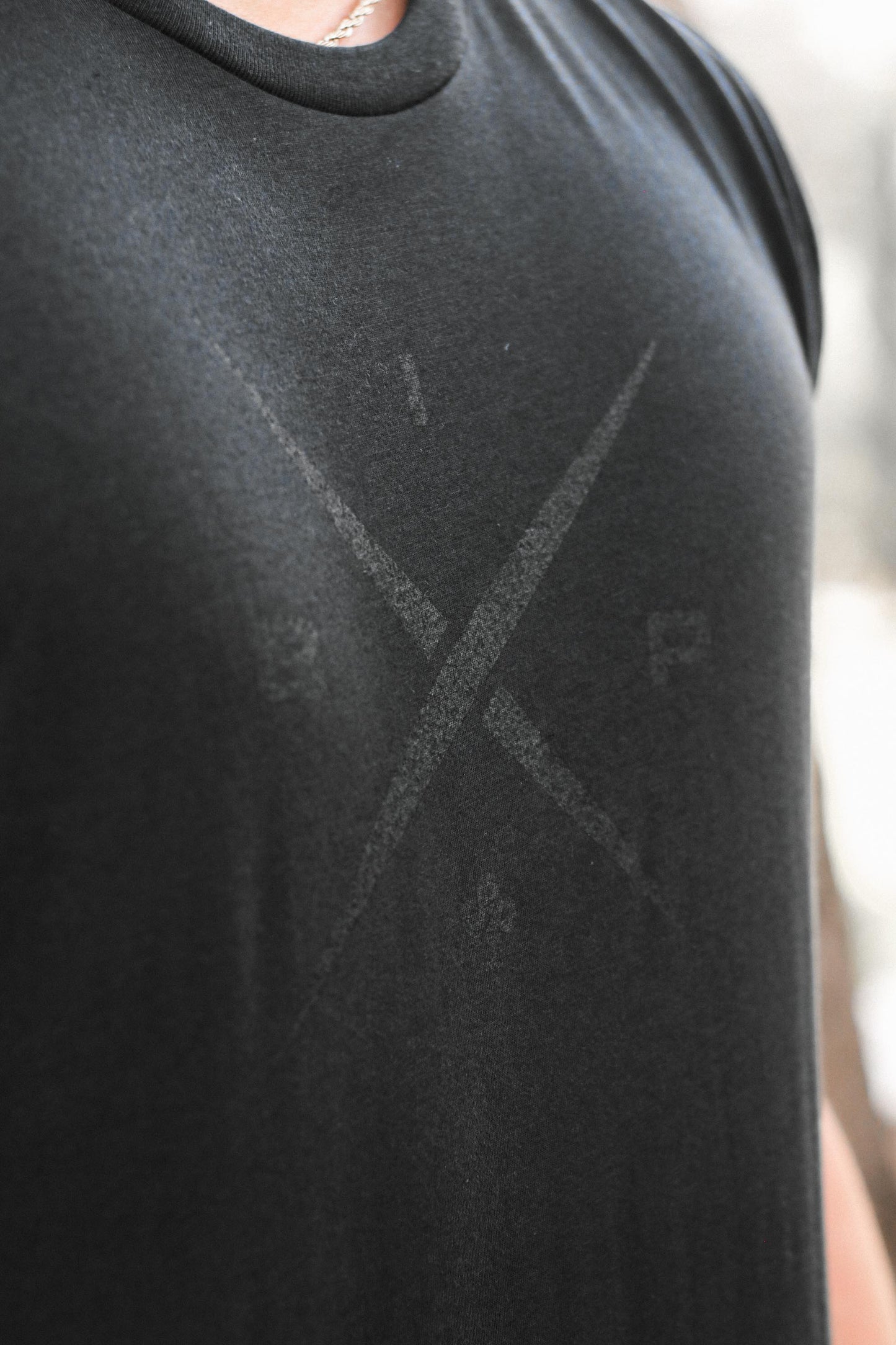 Introducing Nick Ireland wearing the Ireland Boys Productions MAX BLACK merch ft X 2.0 logo in BLACK printed on a BLACK NEXT LEVEL premium T-shirt