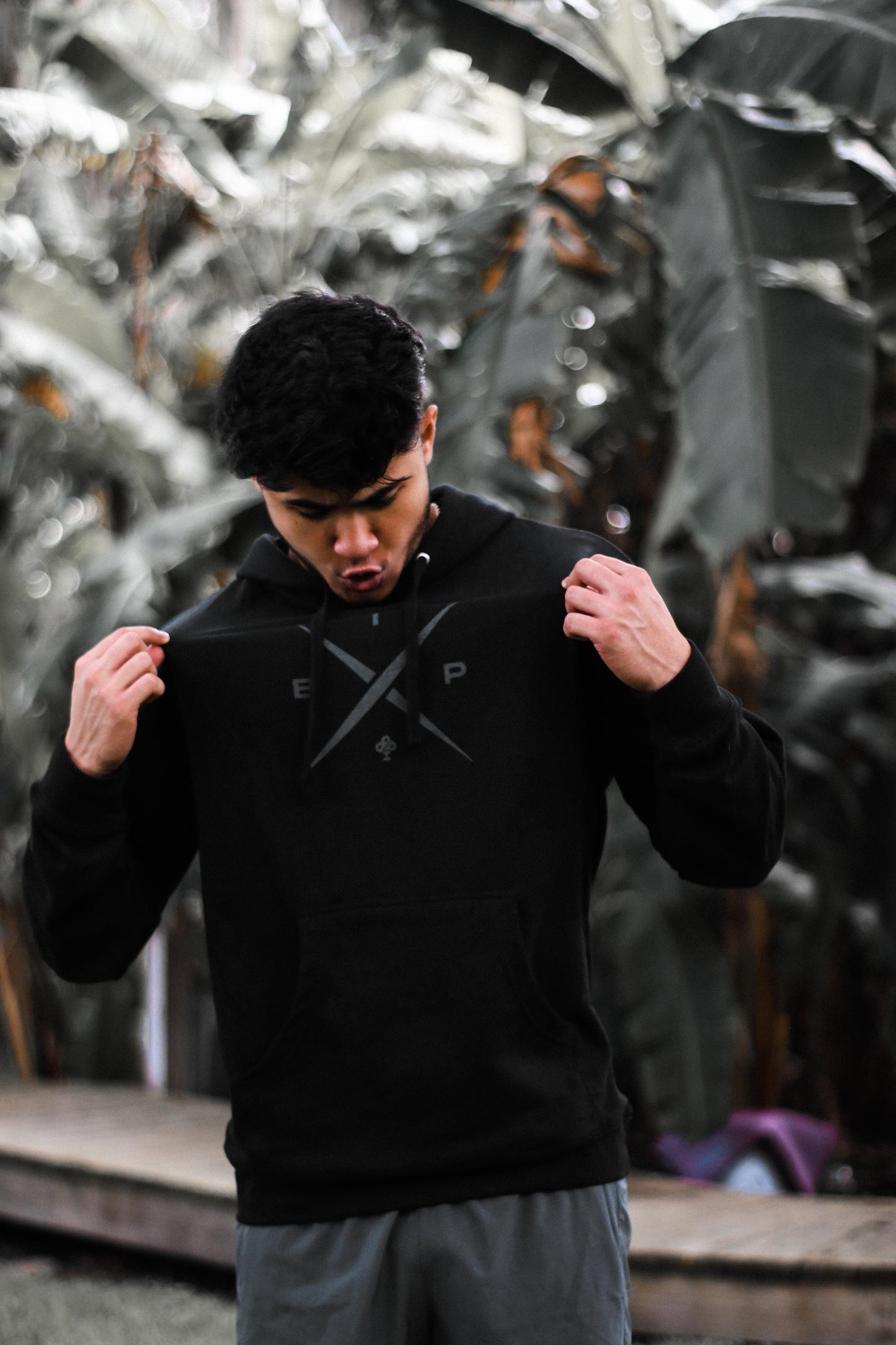 Introducing Nick Ireland wearing the Ireland Boys Productions STEALTH merch ft X 2.0 logo in Asphalt Grey printed on INDEPENDENT premium Hoodie