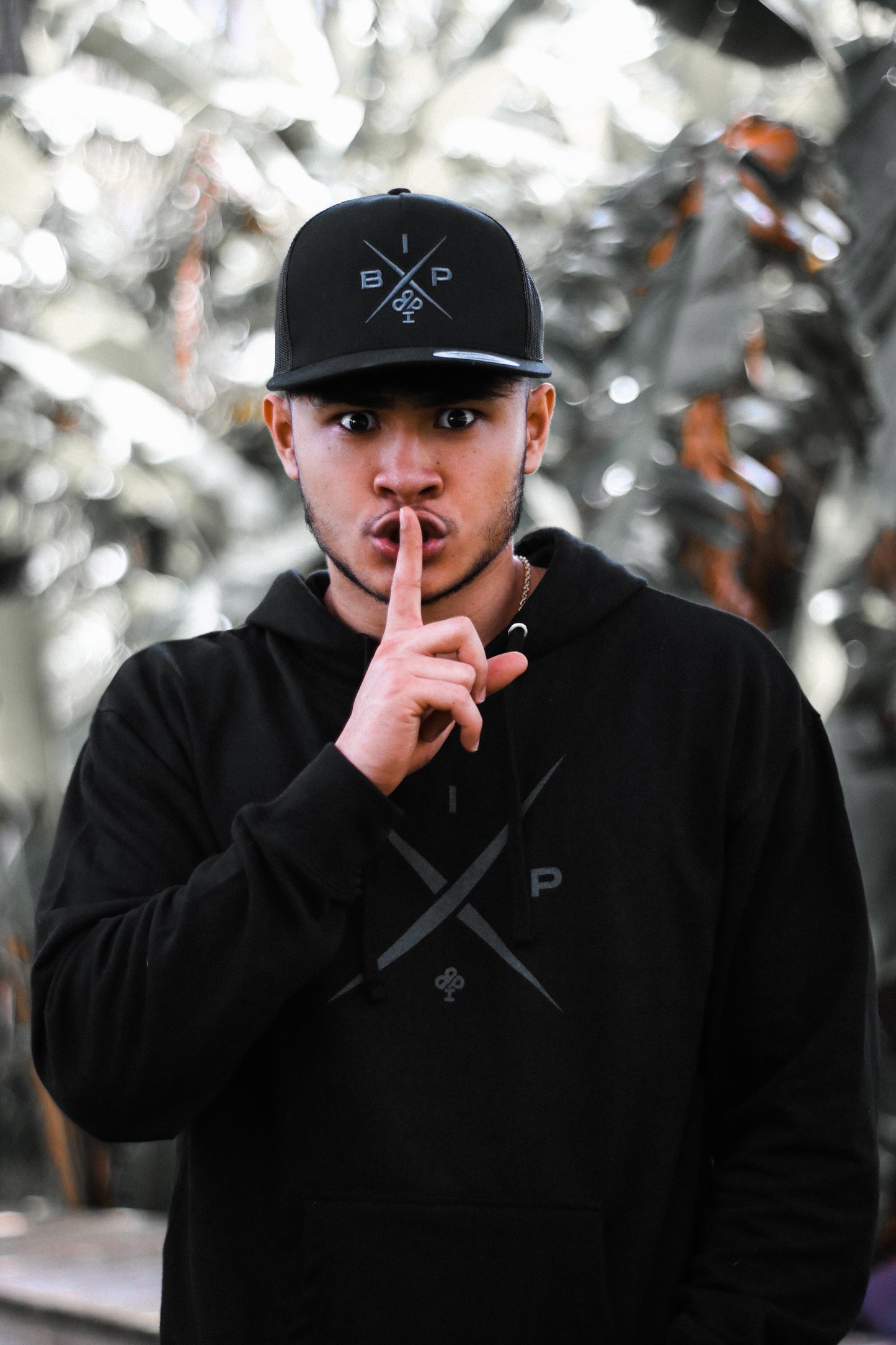 Introducing Nick Ireland wearing the Ireland Boys Productions STEALTH merch ft X 2.0 logo in Asphalt Grey printed on INDEPENDENT premium Hoodie