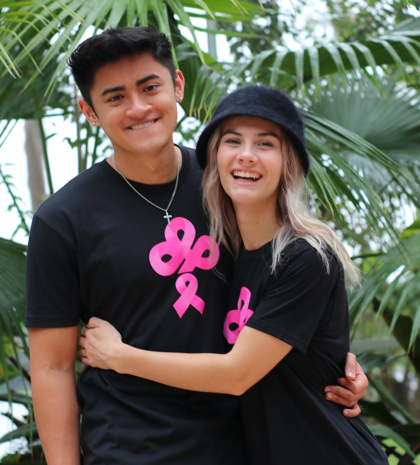 Help Fight Breast Cancer with the purchase of the IBP Ireland Boys pink ribbon logo on black nextlevel t-shirt worn by Ricky Ireland and Morgan of Ireland Boys Productions