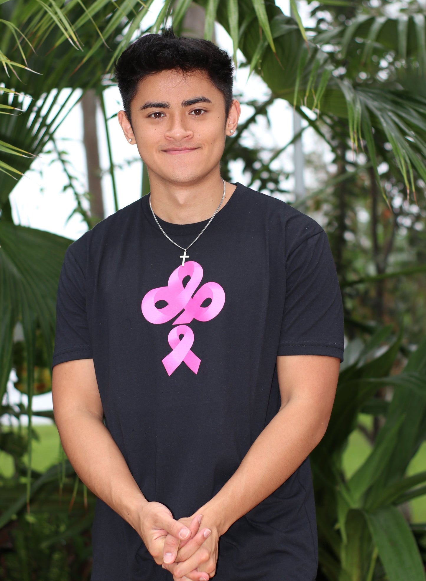 Help Fight Breast Cancer with the purchase of the IBP Ireland Boys pink ribbon logo on black nextlevel t-shirt worn by Ricky Ireland of Ireland Boys Productions